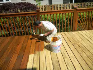 Man Staining Deck